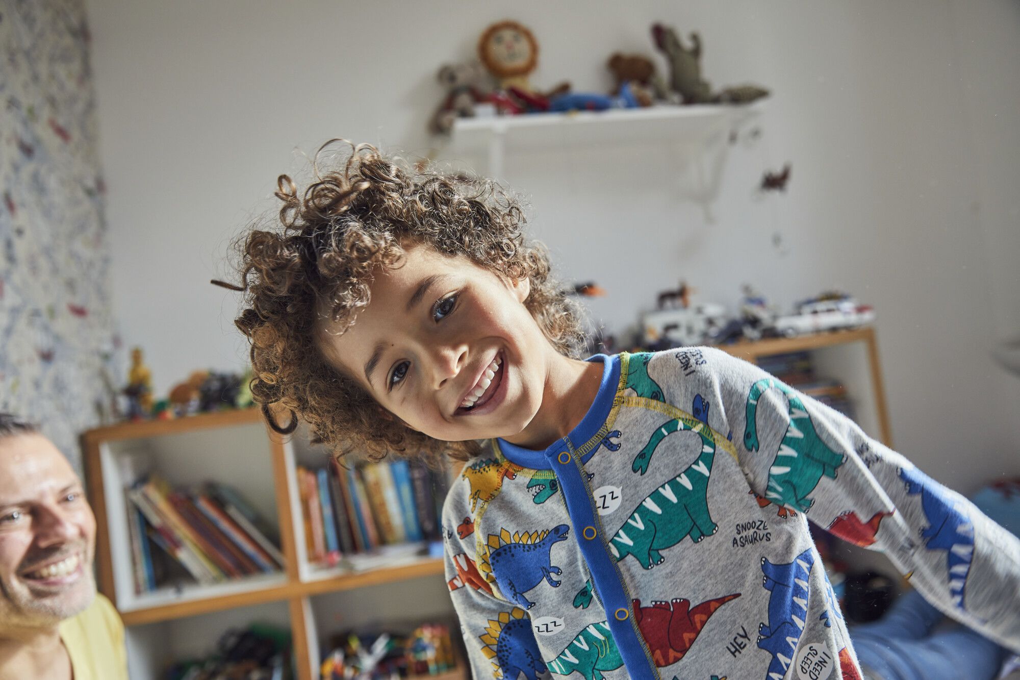 A young boy, smiling
