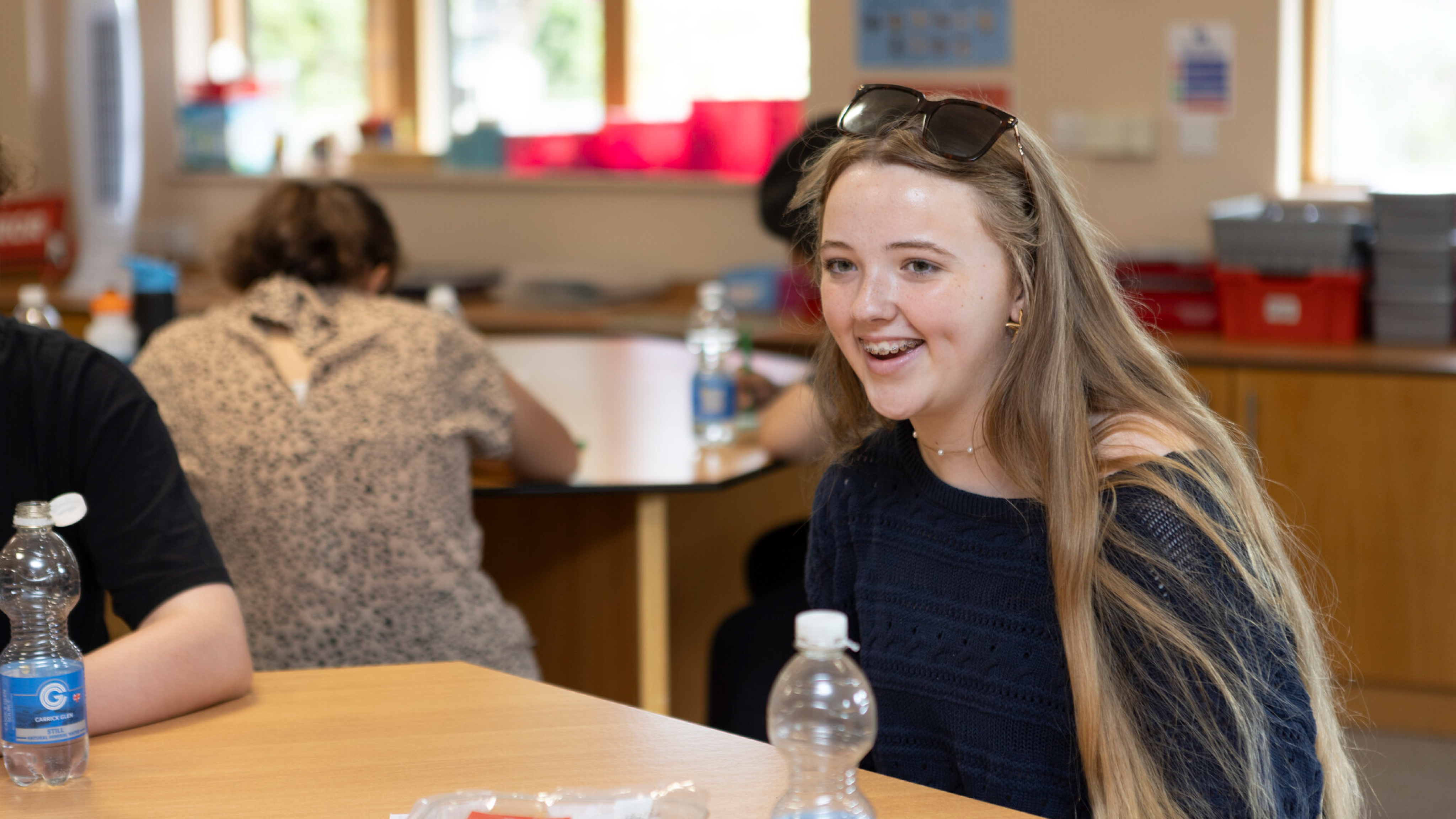A teenage girl, smiling
