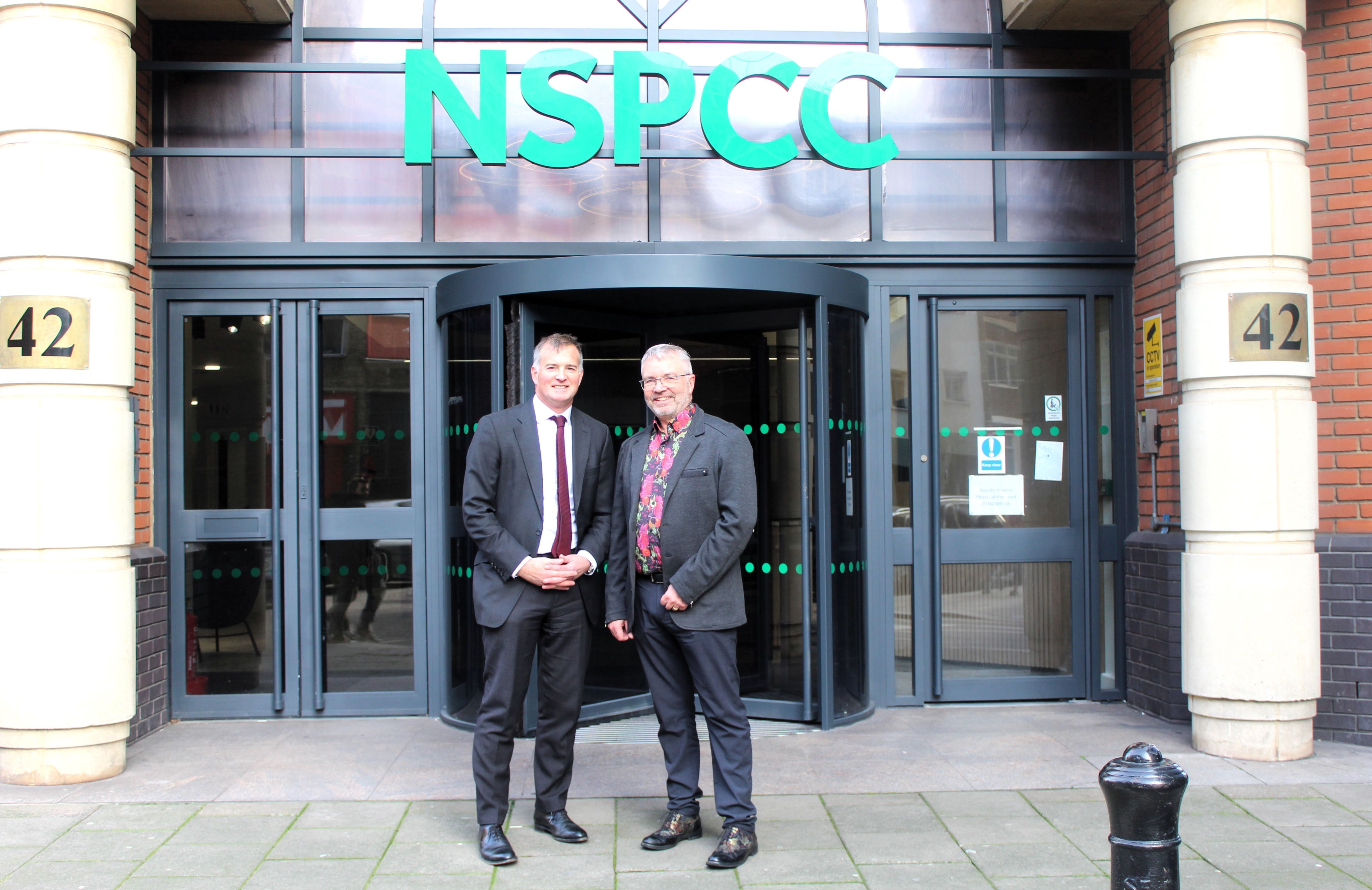 Henry Faure Walker and Peter Wanless stood in front of the NSPCC building
