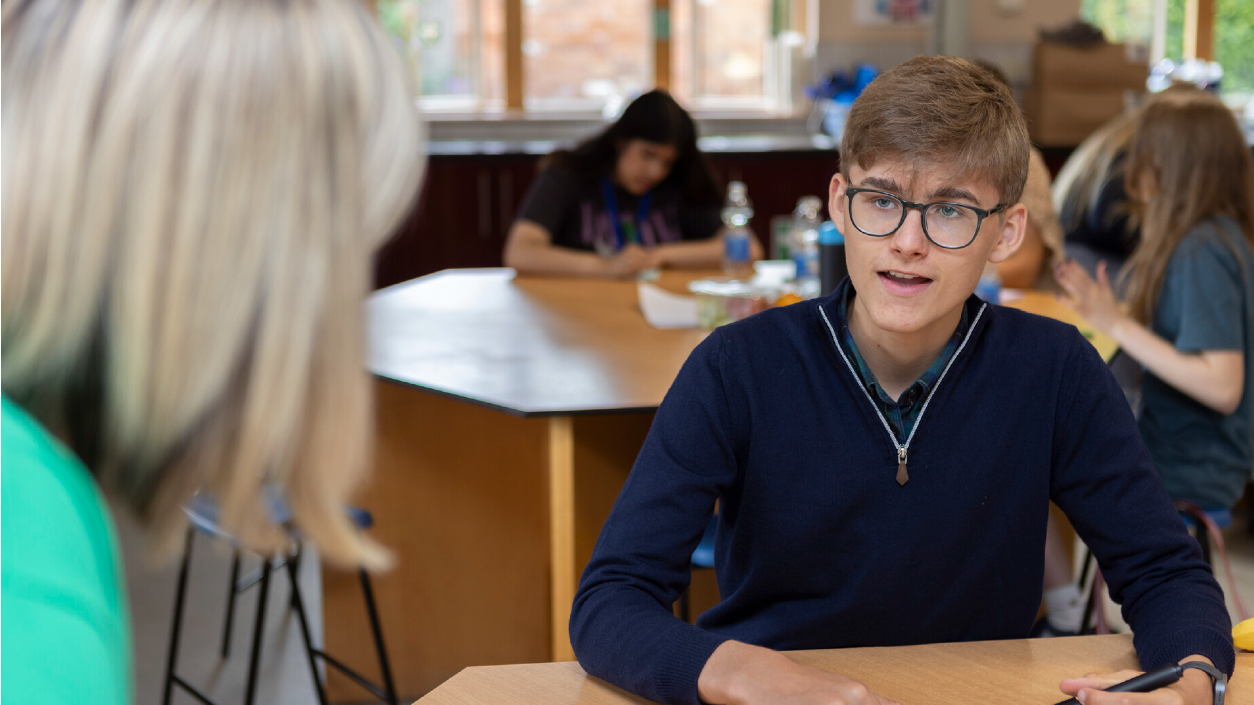 A teenage boy, in conversation