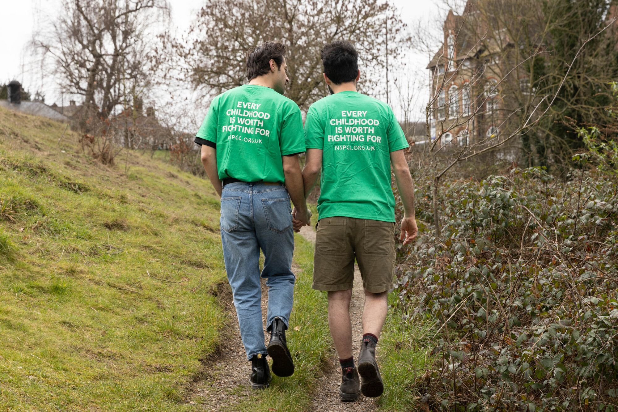 Three people running with NSPCC t-shirts on
